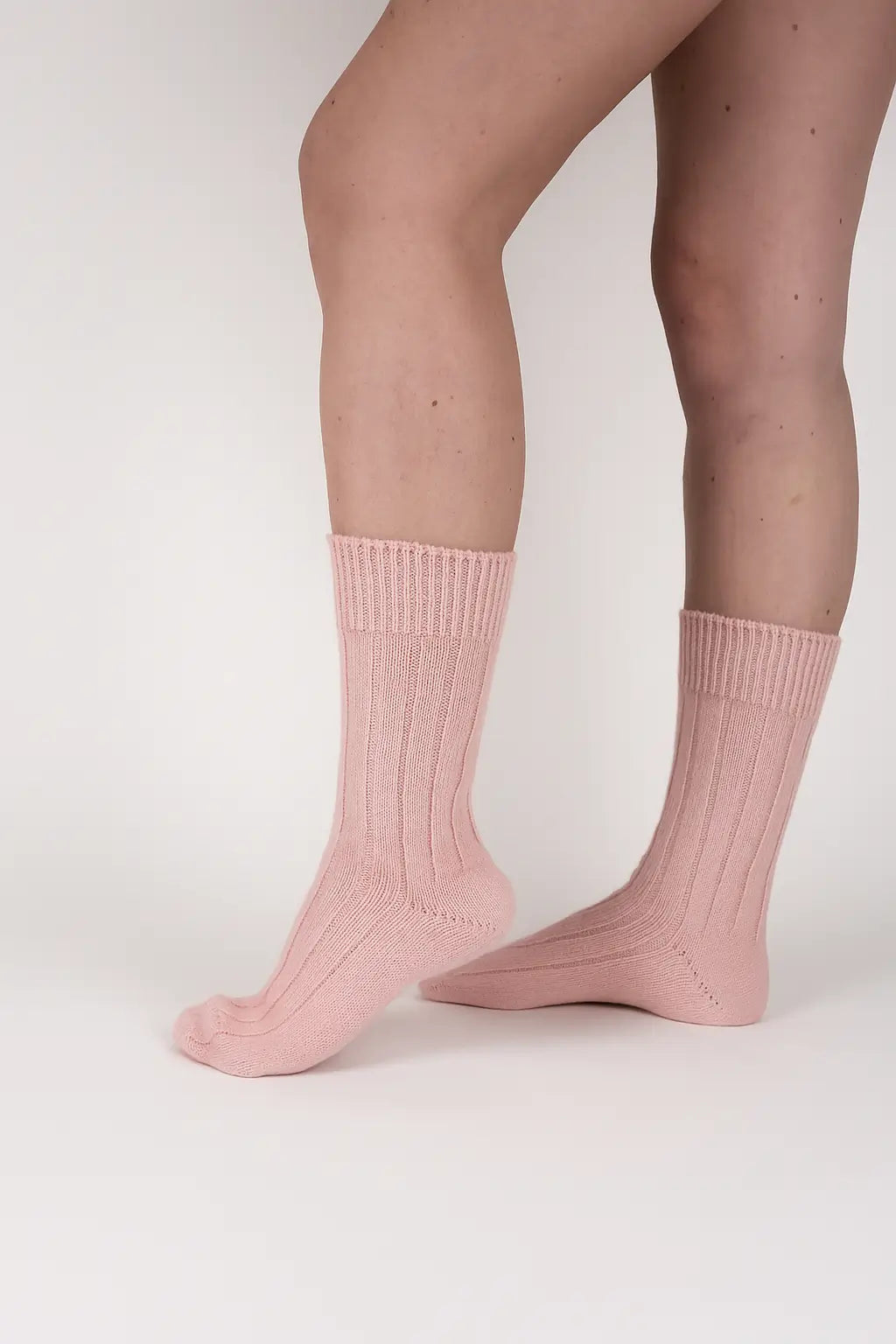 pink socks in a light photographic background