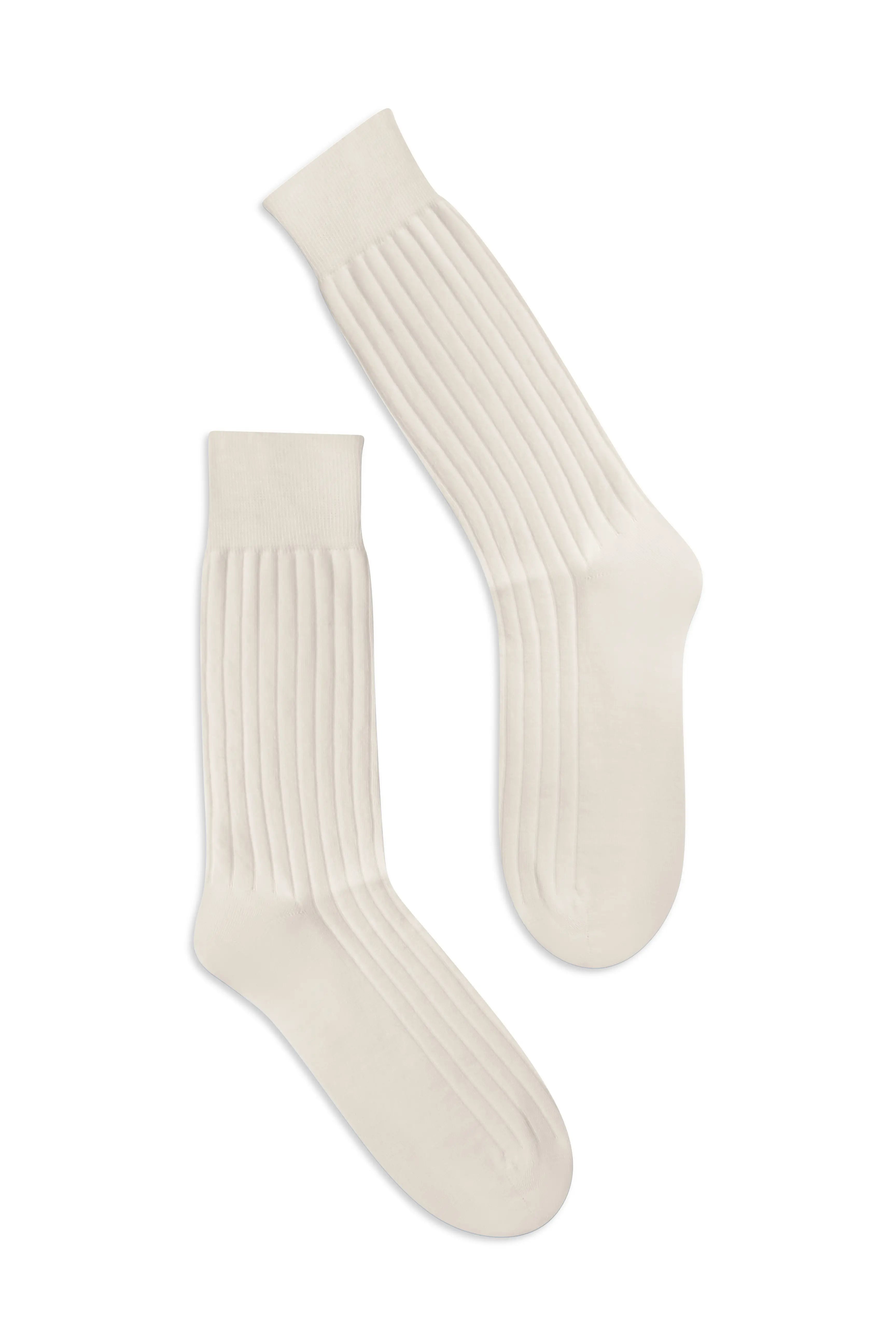 Pair of Panna knee-high socks on a flat lay background