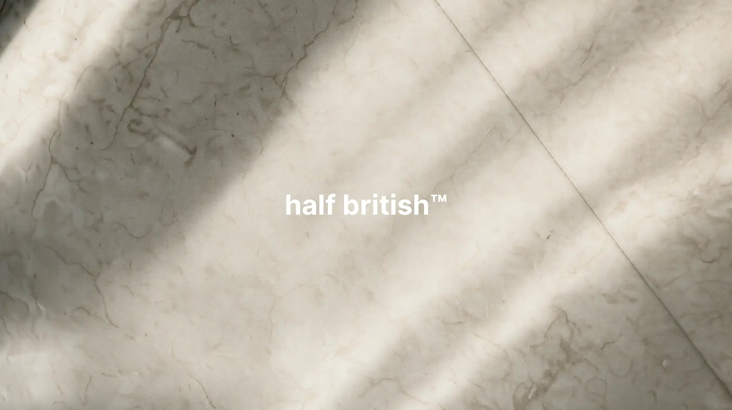 Marble-like surface with 'half british' text overlay