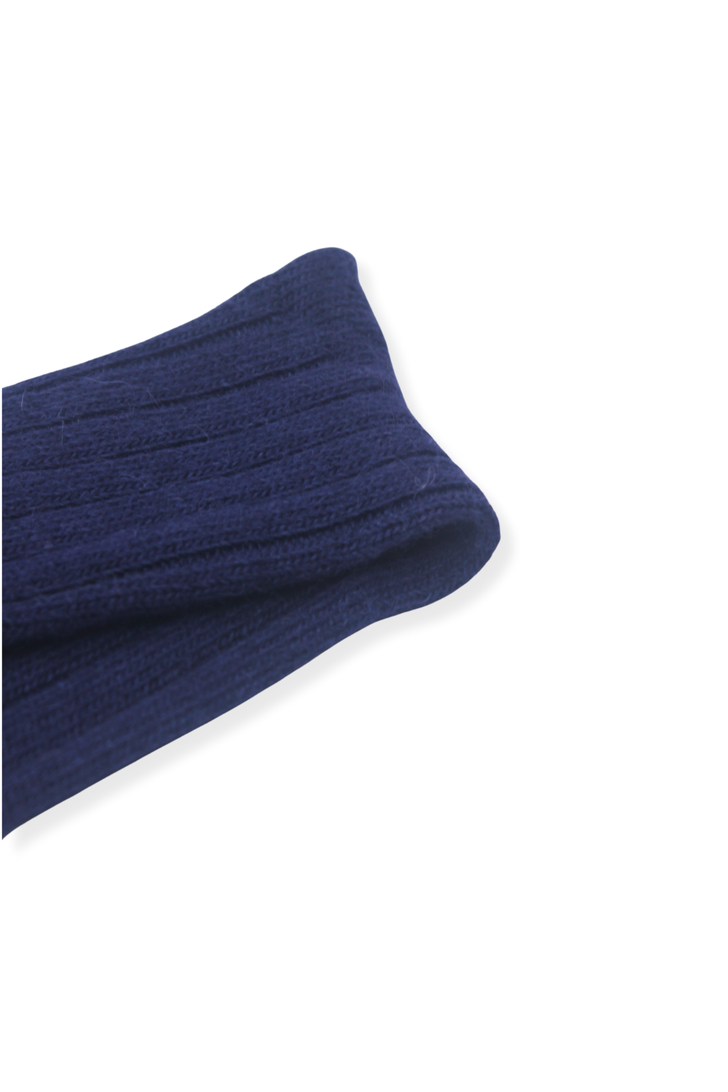 close-up of half british alpaca lounge sock in navy, folded to highlight the ribbed knit detail and fine alpaca wool texture on a white background