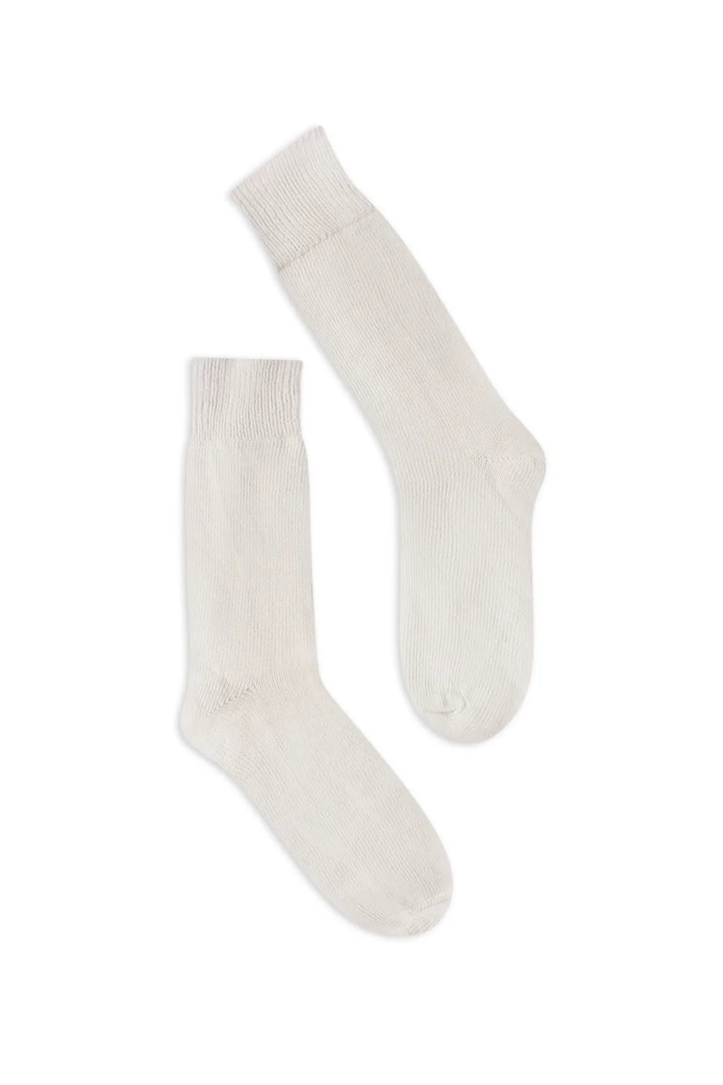 half british everyday alpaca socks in cream, pair laid flat on a white background highlighting the soft alpaca wool texture and refined ribbed finish